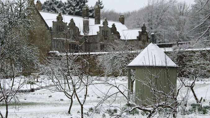 An image of Trerice covered in snow, taken from the orchard, Trerice, Cornwall